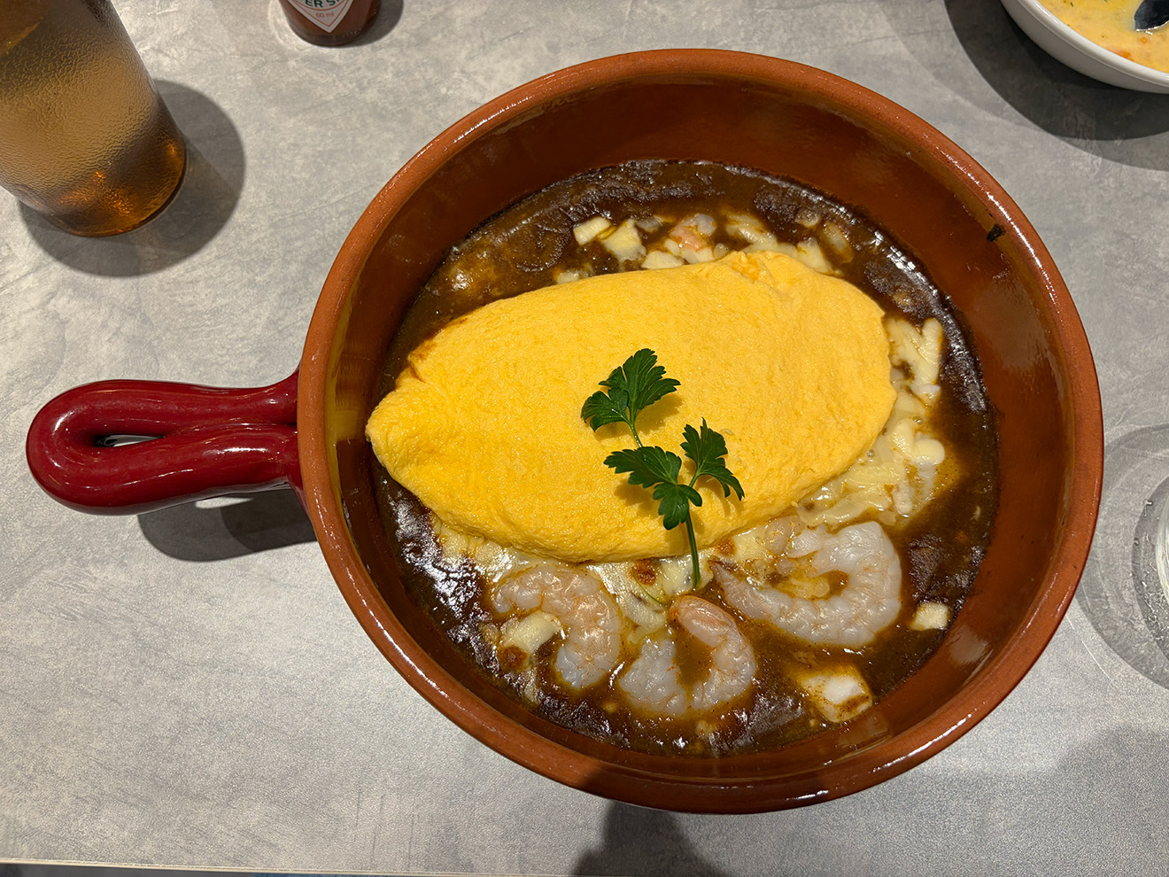「下北沢たまごけん」のシーフード焼きカレーオム